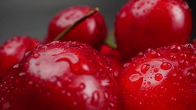 Freshly picked cherries spin on a white plate. Tasty fruits on a dark background, macro shots. Healthy eating, vegetarian diet. Beautifully lit food, tempting to grab. - Powered by Shutterstock - Get 15% off with code: PIKWIZARD15