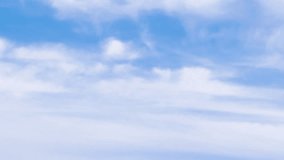 Sunny blue sky and white clouds fast motion away, nature blue skies with soft fluffy cloud. Time lapse of dramatic clouds above the sky, look up view, wide angle shot - Powered by Shutterstock - Get 15% off with code: PIKWIZARD15