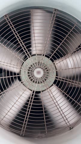 Close-up of a large, gray, industrial fan
