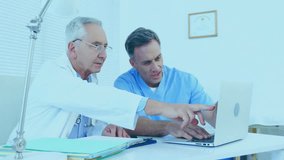Animation of data processing over caucasian doctors using laptop. Global medicine, connections, computing and data processing concept digitally generated video. - Powered by Shutterstock - Get 15% off with code: PIKWIZARD15