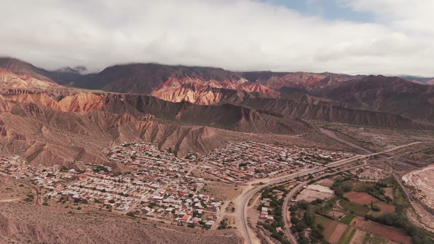 Drone flying above Tilcara, Jujuy province, Argentina, surrounded by Quebrada de Humahuaca.