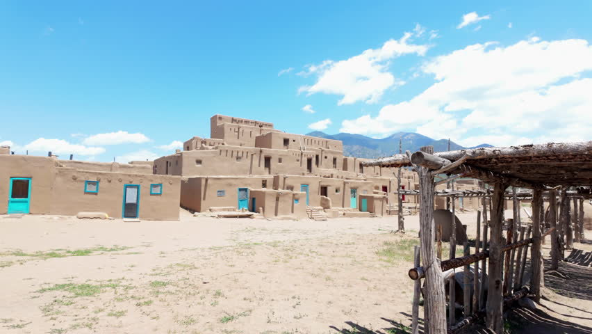 Shade shelters and adobe style houses in Taos Pueblo, the oldest native American pueblo in New Mexico, USA. 