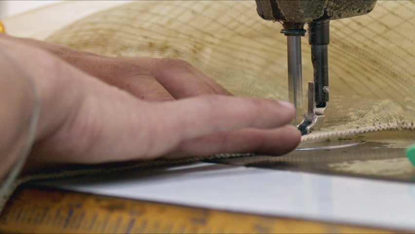 Tailor Sews Curtains with Old Vintage Sewing Machine Footage.