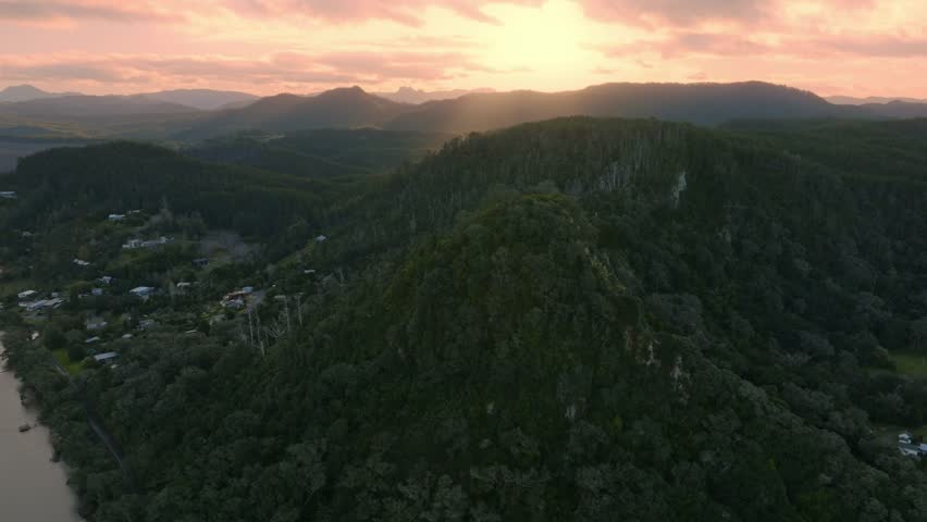 Harbour and mountain range at sunset in Opoutere, Whangamata, Coromandel Peninsula, New Zealand.
