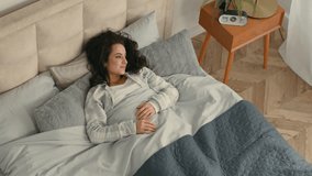 Happy woman stretching lying bed lazy comfortable girl female home hotel rest enjoyment smile good mood relaxed sleepy bedroom satisfaction pleasure weekend glad accommodation awaken daydream mattress - Powered by Shutterstock - Get 15% off with code: PIKWIZARD15