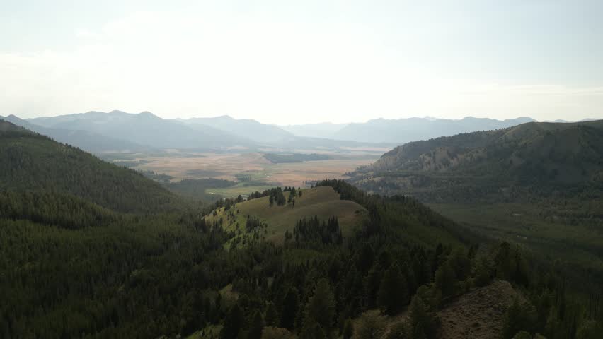 Aerial of Sawtooth national forest mountain valley by Sawtooth City Idaho in summer