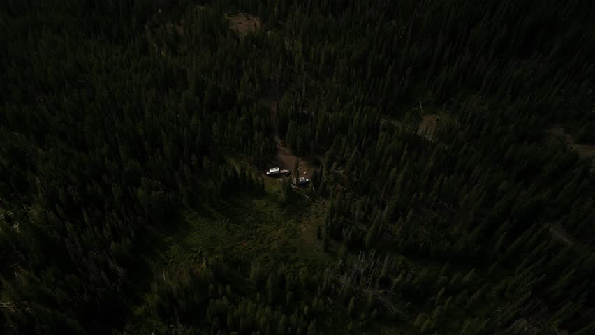 Sawtooth national forest aerial of RVs camping in pine trees near Stanley Idaho