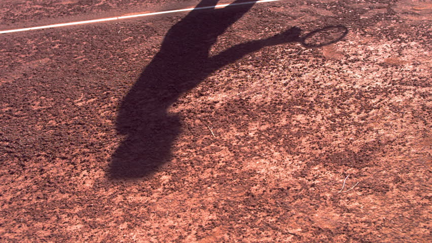 Extreme slow motion shot of a tennis player shadow