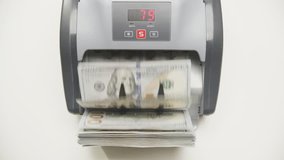Currency Counter Counting Hundred Dollar Bills - Powered by Shutterstock - Get 15% off with code: PIKWIZARD15