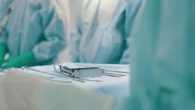 Surgeons prepare instruments in operating room - Powered by Shutterstock - Get 15% off with code: PIKWIZARD15