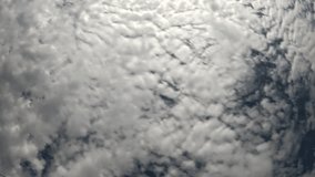Timelapse fluffy Cumulus clouds moving in bright sunset sky. Abstract aerial nature summer ocean sunset, sea and sky view. Vacation, travel, holiday concept. Weather and Climate Change - Powered by Shutterstock - Get 15% off with code: PIKWIZARD15