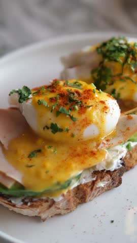 Eggs Benedict with ham on a plate. Delicious breakfast. 