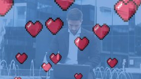 Animation of heart icone over caucasian businessman using laptop. Global finance, business, connections, computing and data processing concept digitally generated video. - Powered by Shutterstock - Get 15% off with code: PIKWIZARD15