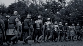 Roman soldiers in unity moving through a woodland trail, showing discipline and military strategy - Powered by Shutterstock - Get 15% off with code: PIKWIZARD15