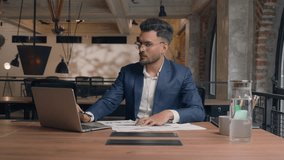 Indian businessman male entrepreneur leader corporate manager work computer laptop write documents paperwork on desk Arabian guy business man happy positive smile guy looking at camera in office cafe - Powered by Shutterstock - Get 15% off with code: PIKWIZARD15