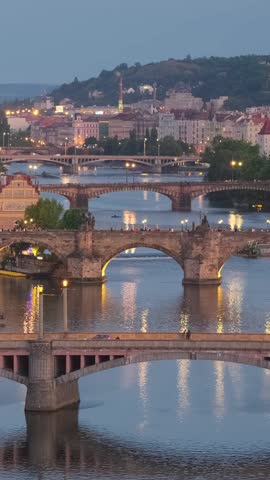 Prague cityscape at night. Prague old town, Charles bridge and Vltava river, Czech Republic. View of famouse Prague old bridges over the Vltava river at twilight Czech capital city.