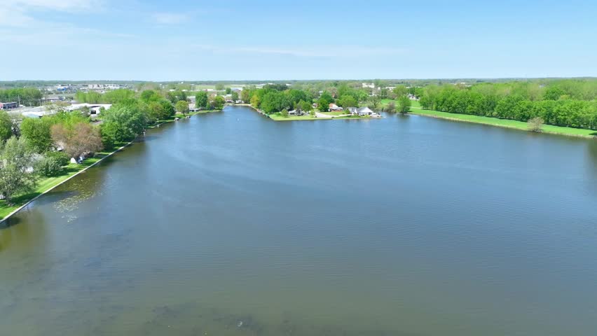 Aerial Fly Over Warsaw Indiana Lake Houses and Lush Greenery