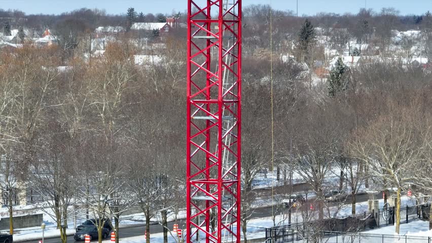 Aerial Pedestal Shot of Red Crane Amid Snowy Fort Wayne Winter Scene