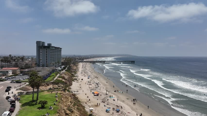 Aerial view of Pacific Beach Coastline on a sunny day in San diego California with people enjoying the beach and park