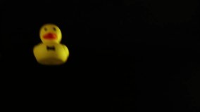 A rubber duck rolls in a dark space - Powered by Shutterstock - Get 15% off with code: PIKWIZARD15