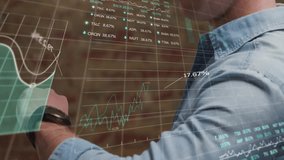 Animation of data processing and caucasian businessman checking smartwatch. Business, technology and digital interface concept digitally generated video. - Powered by Shutterstock - Get 15% off with code: PIKWIZARD15