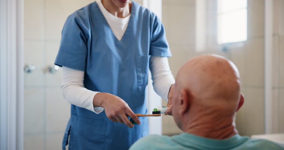 Brushing teeth, nurse and senior man with healthcare caregiver with help for patient with dementia. Medical, dental and oral hygiene support with people in bathroom for wellness in retirement home