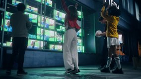 Diverse Group of People Cheer and Celebrate while Watching a Soccer Championship Event on a Neon Storefront TV Display at Night. Young Men and Women Excited and United on a Lively City Street - Powered by Shutterstock - Get 15% off with code: PIKWIZARD15