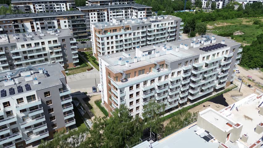 Contemporary apartment buildings with gardens and parking spaces