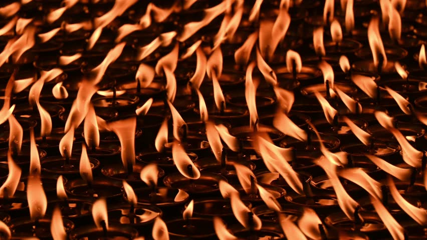 Light candles in Swayambhunath temple, Nepal. The faithful also light candles as a sign of gratitude to God for answered prayers.