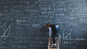 Time lapse of genius kid writing formulas on chalkboard working at academic research studying in classroom in school. Education and childhood concept. - Powered by Shutterstock - Get 15% off with code: PIKWIZARD15