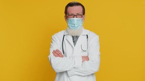 Senior elderly doctor cardiologist man wearing medical mask on face protection from bronchitis asthma allergy flu pneumonia disease problem. Old apothecary pharmacy grandfather on yellow background - Powered by Shutterstock - Get 15% off with code: PIKWIZARD15