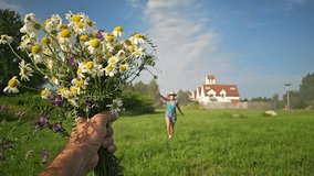 woman running across the field for a bouquet of daisies, field bouquet, happy girl, blue sky, clouds, old houses, woman in sherts, summer - Powered by Shutterstock - Get 15% off with code: PIKWIZARD15