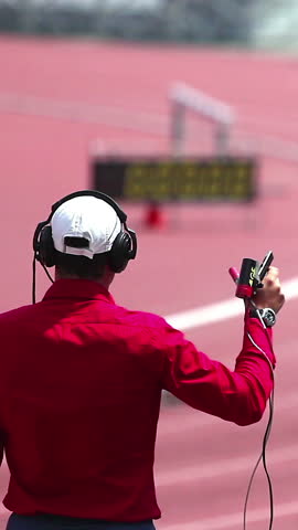 Referee starts the race of the athletes.