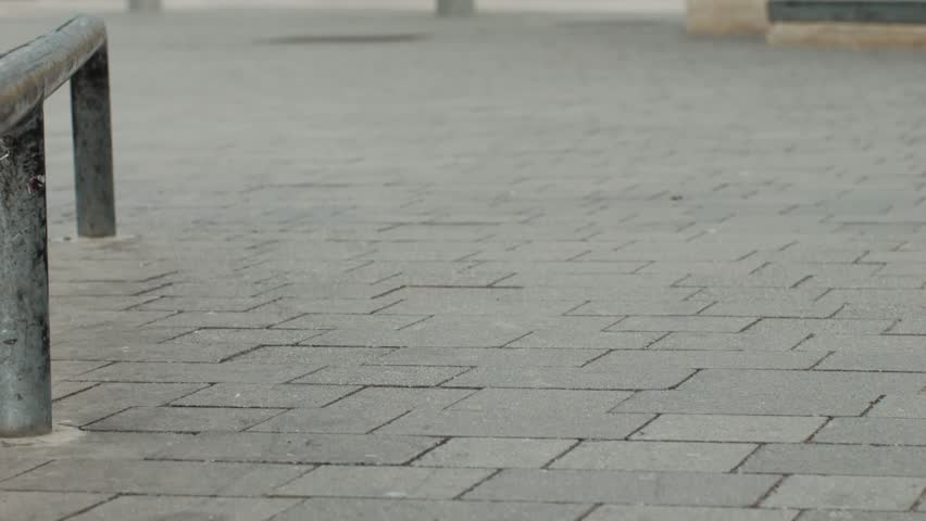 Young skater making 360 flip jump, performing kickflip trick, skateboarder training in skatepark, making tricks, slides and flips, professional extreme sport athlete training ride on skateboard. 