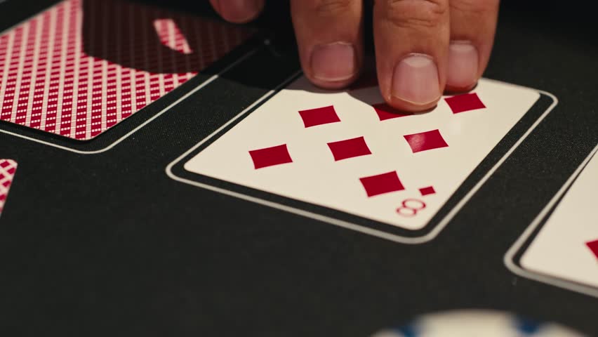 Game of poker in casino, taking place with poker chips and cards on a green table, gambling place, roulette jack pot. 