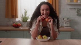 Hispanic woman Latina girl Caucasian female housewife homeowner home kitchen happy smiling toothy at camera portrait holding vitamin healthy apples fruits health care vegetarian breakfast morning diet - Powered by Shutterstock - Get 15% off with code: PIKWIZARD15