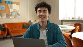 Caucasian concentrated man male student guy boy schoolboy pupil typing prepare exam online internet school university cafe studying learning education laptop computer e-learning smiling toothy braces - Powered by Shutterstock - Get 15% off with code: PIKWIZARD15