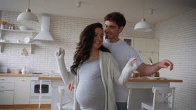 Happy funny active fooling having fun move listening music home party celebrate relocation pregnant couple dance pregnancy medical insurance health dancing man guy male father woman girl female mother - Powered by Shutterstock - Get 15% off with code: PIKWIZARD15