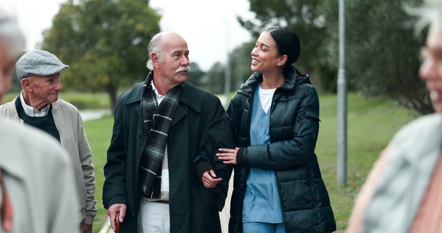 Assisted living, community or conversation with nurse and old people outdoor together for activity. Healthcare, friends and senior group walking in garden with happy caregiver for medical wellness