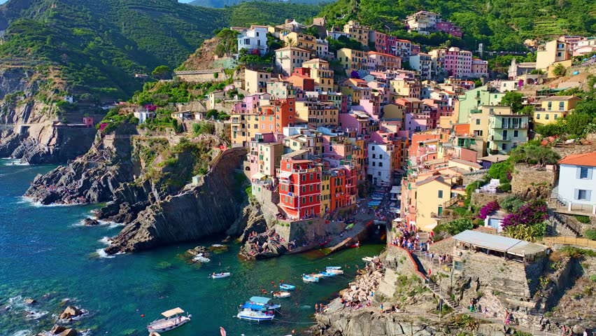 aerial video of Cinque terra in Italy, Riomaggiore town in Cinque terra on Italian riviera, vacation in Liguria, Italy, holiday in Italy. High quality 4k footage