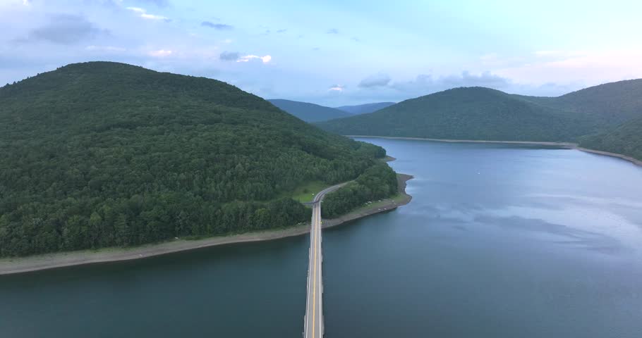 Summer aerial video of the bridge of the Cannonsville Reservoir, Delaware County, NY, NYC DEP water supply	
