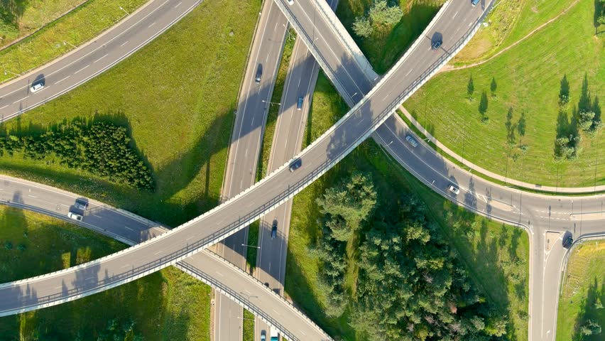 Aerial rotating top-down view of three level road junction. Vilnius. Lithuania.
