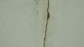 Old concrete wall background with large crack.Grey cement wall surface with large damage. - Powered by Shutterstock - Get 15% off with code: PIKWIZARD15