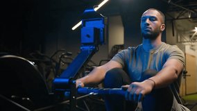 Sport determination hard exercise with equipment in sportive club muscles workout African American strong man sporty male guy athlete sportsman bodybuilder in gym pulling rope rowing machine sitting - Powered by Shutterstock - Get 15% off with code: PIKWIZARD15