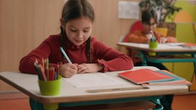 School education studying Caucasian little girl daughter child kid writing test exam in classroom class lesson turn to boy classmate ask right answer son schoolboy help tell suggest correct answering - Powered by Shutterstock - Get 15% off with code: PIKWIZARD15