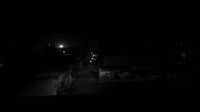 An epic night view from a moving train of buildings, roads, and vehicles at an indian village.view from a moving train - Powered by Shutterstock - Get 15% off with code: PIKWIZARD15