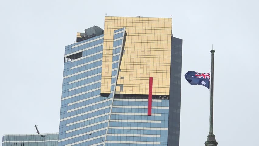 View of Eureka tower and waving australian flag in Melbourne, Australia