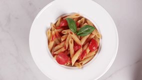 pasta penne in white plate food rotation - Powered by Shutterstock - Get 15% off with code: PIKWIZARD15