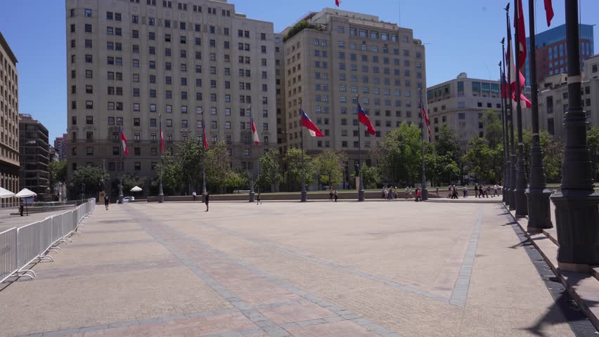 Flags at the La Moneda Palace, the presidential building in Santiago, Chile