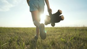 Child running in park with teddy. Happy child enjoying nature and sunshine. Joyful moments as child runs freely. Active lifestyle carefree play in park. Scenic adventure child running with teddy bear - Powered by Shutterstock - Get 15% off with code: PIKWIZARD15